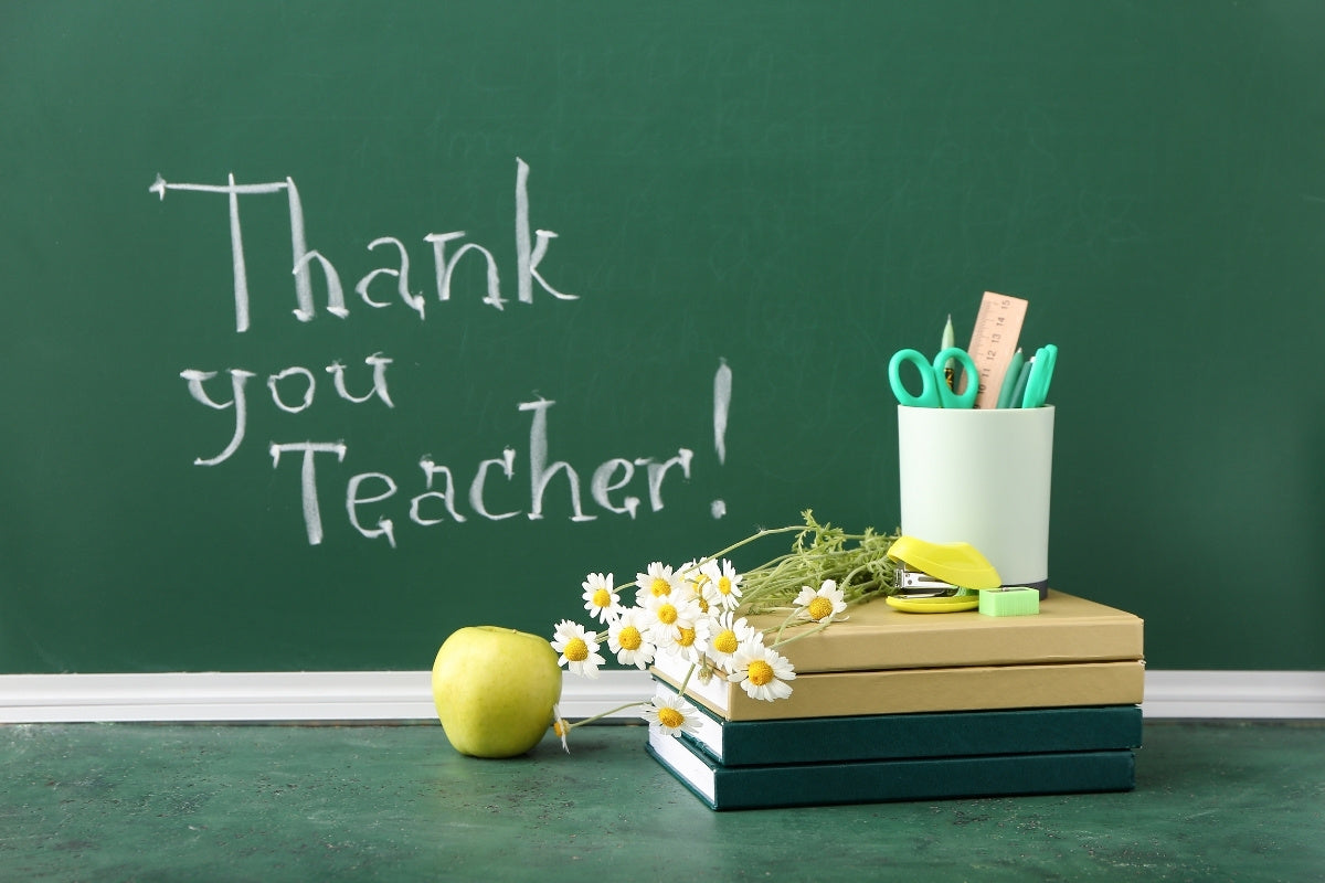 Books with Flowers, Apple, Stationery and Text THANK YOU TEACHER on Color Background