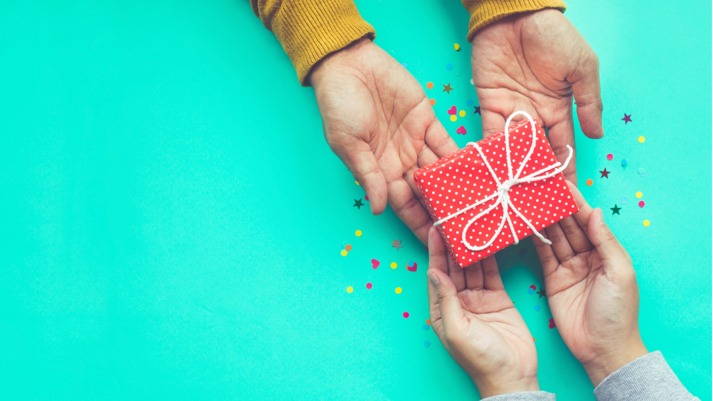 hands exchanging gifts in Singapore; gift singapore; gift delivery singapore; same day delivery; gift guide