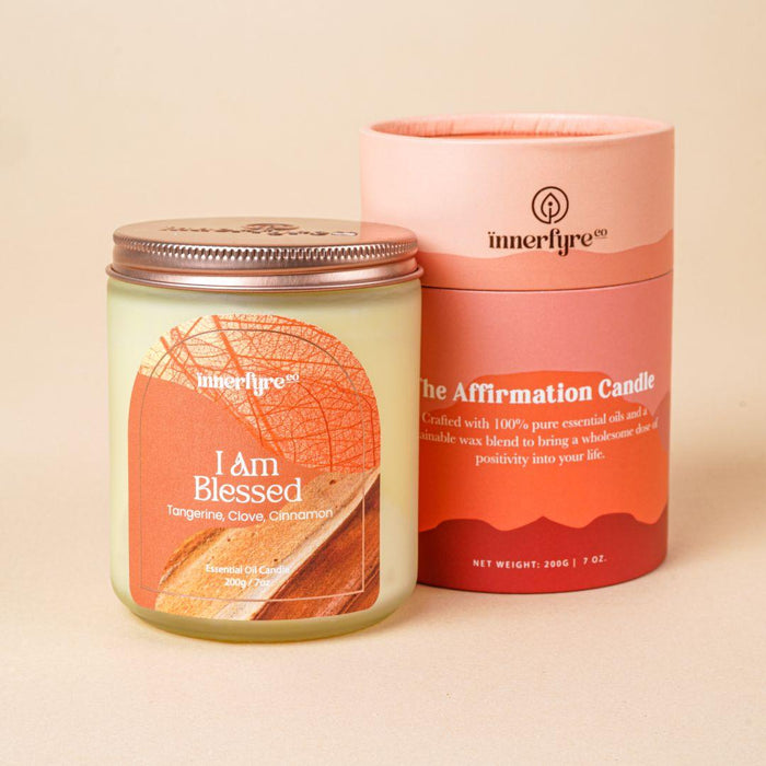 I Am Blessed scented candle and cylindrical packaging