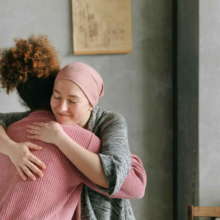 Get well soon gift ideas; two women hugging: nurse and patient