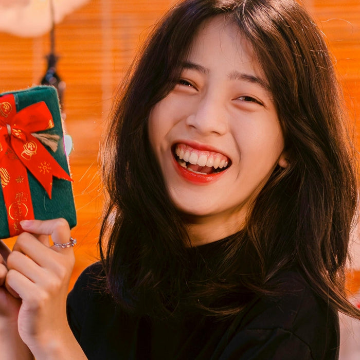 Smiling Woman with Christmas Corporate Gift Box