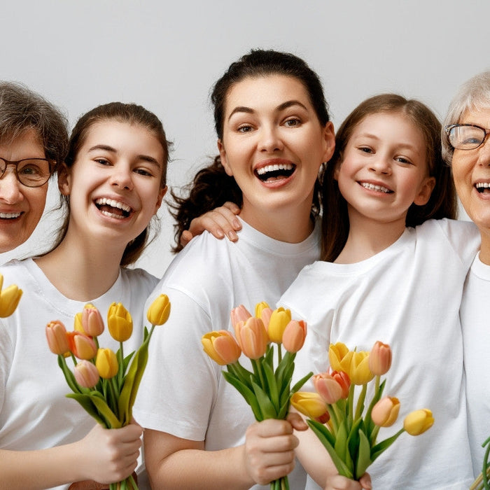 Women holding flower gifts on International Women's Day