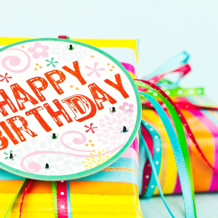 colourful birthday gifts with gift tag