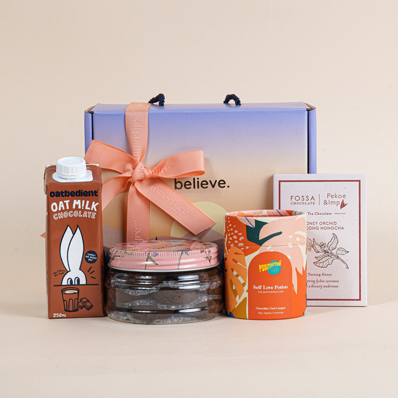 gift bundle with cookies, oat milk, tea and chocolate