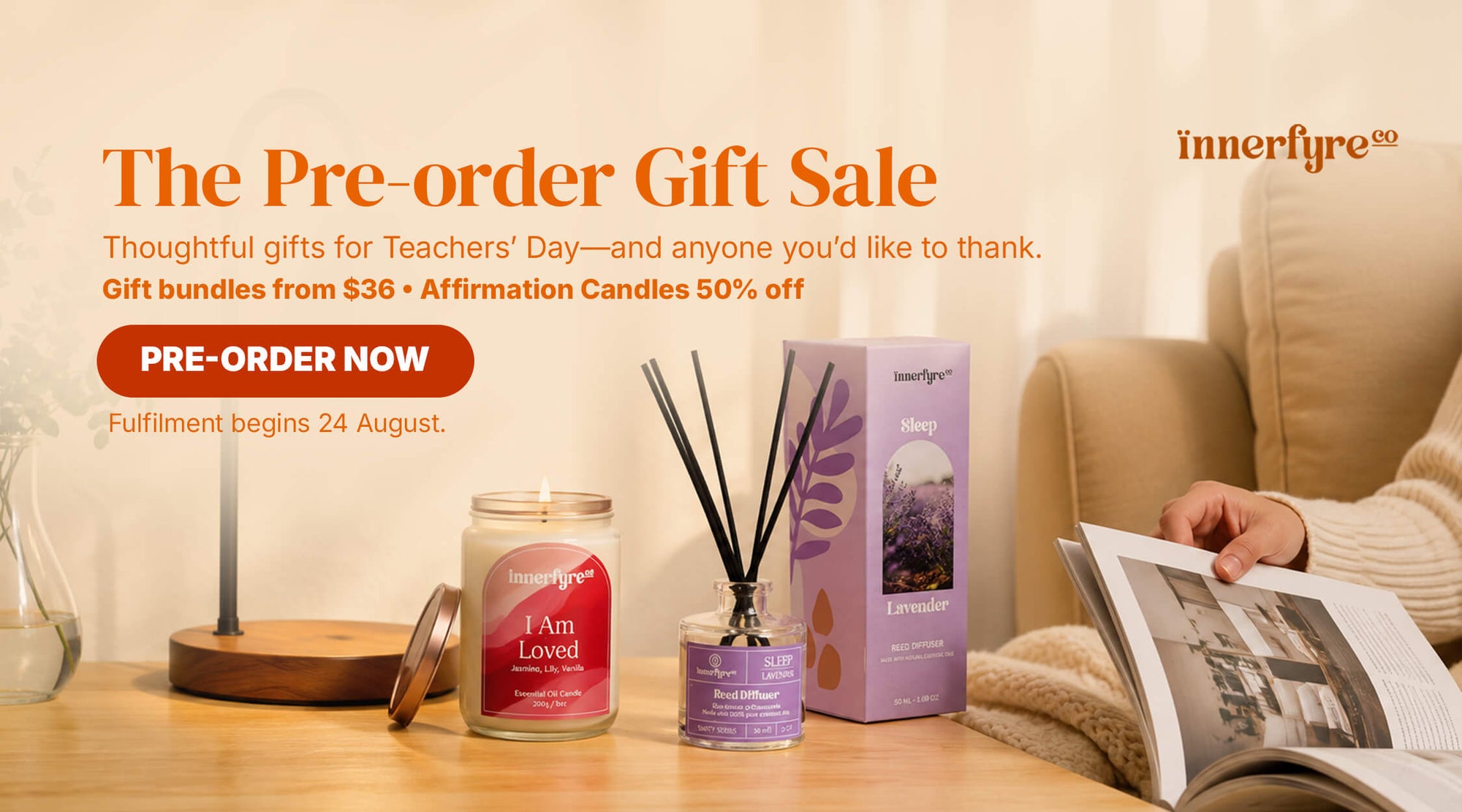 Promotional banner for innerfyre pre-order gift sale featuring a lit candle, a reed diffuser, and a lavender-themed box on a wooden table next to a person reading a book in a cozy living room setting.