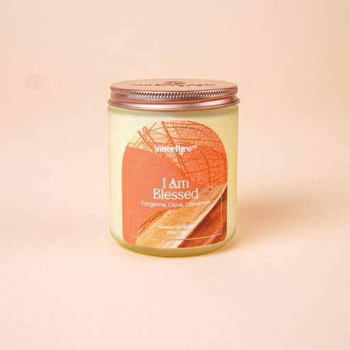 I Am Blessed scented candle in clear frosted jar and bronze lid with Innerfyre logo