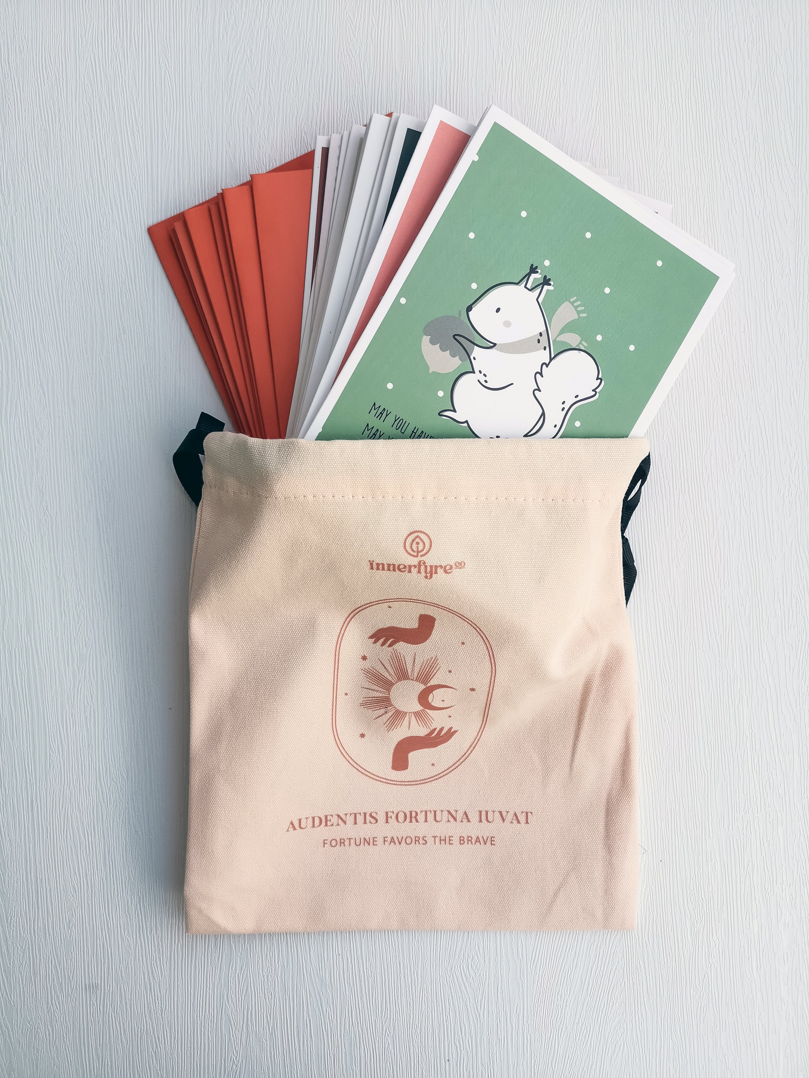Christmas cards in a cotton drawstring bag