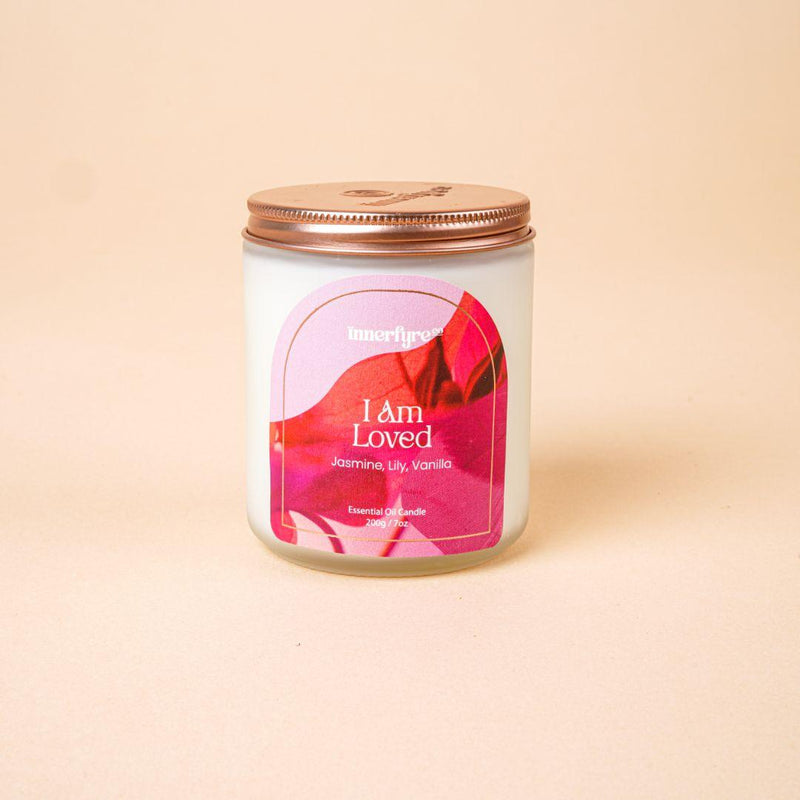 I Am Loved scented candle in clear frosted jar and bronze lid with Innerfyre logo